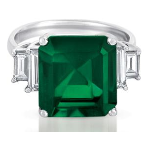 Step cut emerald and baguette cut diamond ring